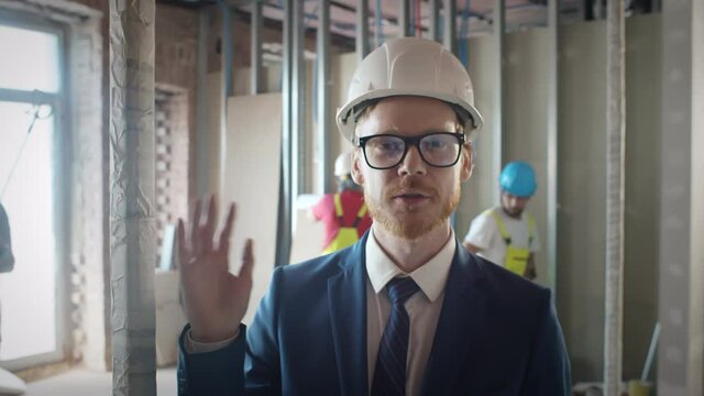 Foreman talking via video chat with owner on construction site