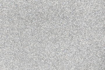 Sparkling shiny silver background with glitter. Shiny textured surface.