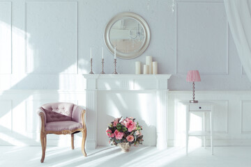 luxury clean bright white interior. a spacious room with sunlight and flowers in vases and royal chic furniture. 