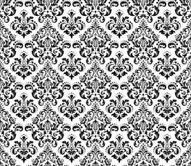 Wallpaper in the style of Baroque. Seamless vector background. White and black floral ornament. Graphic pattern for fabric, wallpaper, packaging. Ornate Damask flower ornament