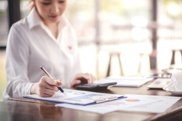 Businessman analyzing and recording information about financial business