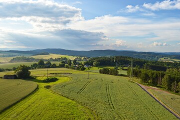 Beautiful Czech republic countryside with fields and mountains in the background