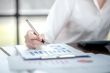 Businessman analyzing and recording information about financial business