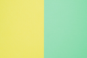 Two-color paper background. The background is yellow and delicate mint color, divided vertically...