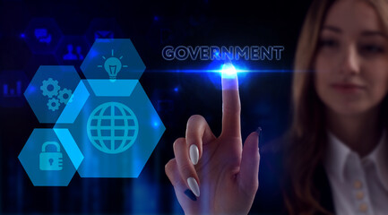 Business, Technology, Internet and network concept. Young businessman working on a virtual screen of the future and sees the inscription: Government