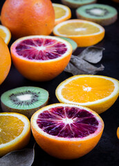 A close-up photo of thin slices of lemon and kiwi together.