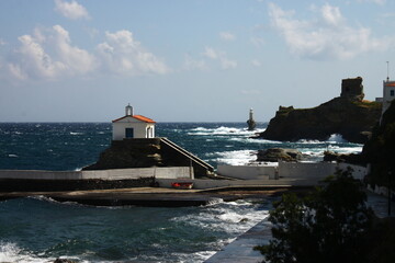 Waves at the small harbour in front of the Chapel of Panagia Thalassini at Andros, Greece 