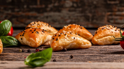 Uzbek national dish samosa. Indian samosas baked pastry with savoury filling, popular Indian snacks, served in bowl with spices on rustic background