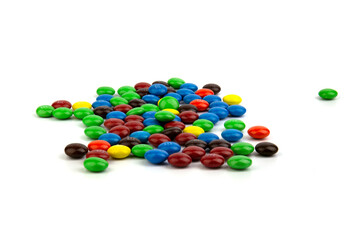 Suratthani Thailand - June 29, 2020: M&M's candies. M&M's produced by Mars, Incorporated. Close up of a pile of colorful chocolate coated candy, chocolate pattern, candies background