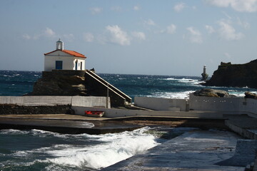 Waves at the small harbour in front of the Chapel of Panagia Thalassini at Andros, Greece 