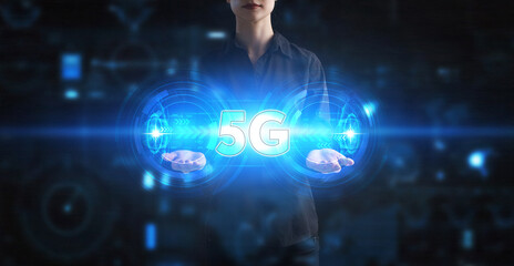 Business, Technology, Internet and network concept. Young businessman working on a virtual screen of the future and sees the inscription: 5G