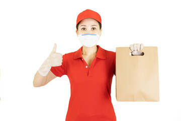 Fototapeta na wymiar Staff,Asian Delivery in red uniform isolated on white background.Courier in protective mask and medical gloves,concept delivers service under quarantine