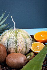 Pineapple, cantaloupe, orange, kiwi.Strawberry.