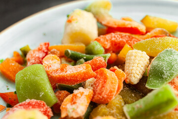 Multi-colored frozen vegetables, summer vitamin set. Healthy food in winter.