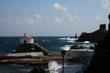 Waves at the small harbour in front of the Chapel of Panagia Thalassini at Andros, Greece 
