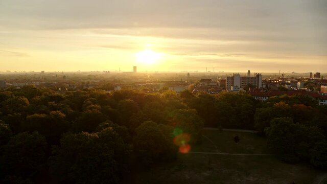 Sunset over Berlin cityscape and treetops, Germany