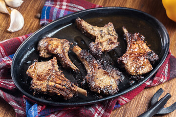 Roasted lamb chops on a roasting dish