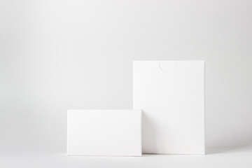 Two white boxes on a white background. On the boxes there is a place for inscriptions and logos