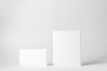 Two white boxes on a white background. On the boxes there is a place for inscriptions and logos