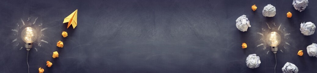 Education concept image. Creative idea and innovation. Light bulb as metaphor over blackboard © tomertu