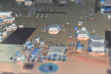 Fragment of a PC motherboard. Part of the main circuit board close-up. Gray pink inverted...