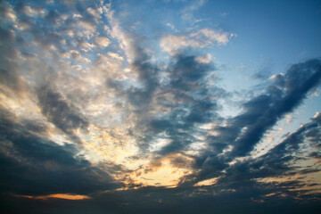 Naklejka na ściany i meble Dramatic sky with clouds at dawn hour before sunrise.