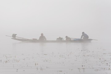 Fototapeta na wymiar Traditional fisherman on a boat on Inle Lake Myanmar Burma