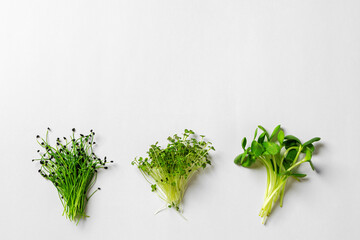 Top view of little bunch of micro greens on paper background