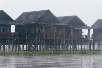 Houses on Inle lake in Nyaungshwe Township of Shan State. Shan Hills in Myanmar Burma