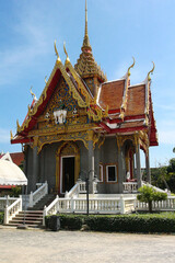 Beautiful carved gilded Buddhist pagoda at Wat Chalong Temple. Religion. Thailand. Journey. Travels