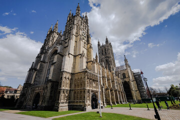 Wide angle view at Canterbury Cathedral in early spring with blue sky and clouds