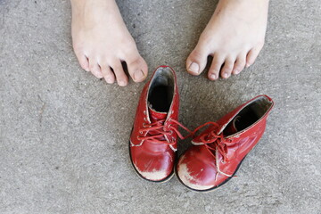 old red children pair of leisure boots and woman foot