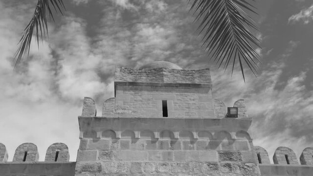 Black and white video timelapse of old walls of ancient building in Tunisia. Sousse city.
