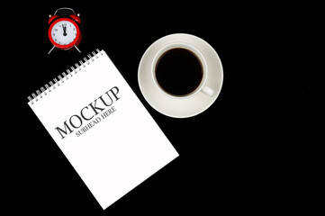 Obraz na płótnie Canvas mockup of white notebook coffee mug and watch