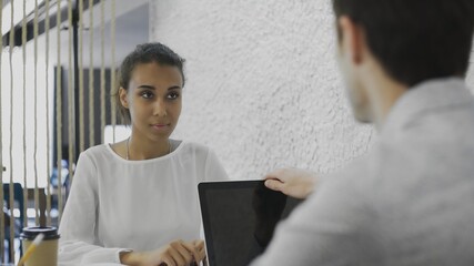 Fototapeta premium Man vacancy candidature answers on questions during job interview. End of job interview, hand shake