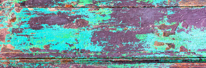 Abstract grunge wood planks textured panoramic background with peeling green paint