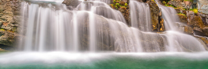 Panorama of Lillaz waterfalls near Cogne, Gran Paradiso national park, Aosta Valley in the Alps, Italy