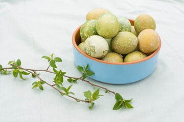 Decorated easter eggs in the glass bowl