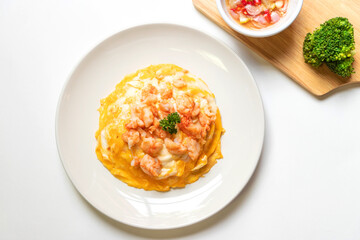 Creamy omelette with shrimps on rice served fish sauce with Thai chilis (Thai condiment “Prik Nam Pla”). Delicious and easy menu.  