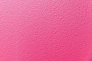 Cement wall patterned with pink color texture and seamless background