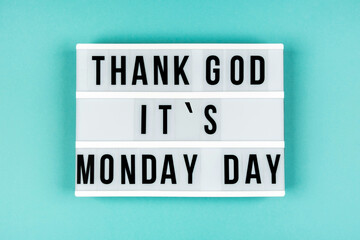 Text THANKS GOD IT IS MONDAY DAY on lightbox on blue background