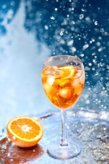 Fototapeta na wymiar Summer alcoholic refreshing cocktail - Aperol spritz. Popular italian drink