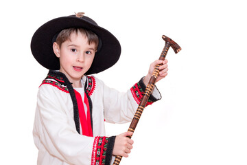 Boy age 6 boy  in costume of highlander. Funny faces.
