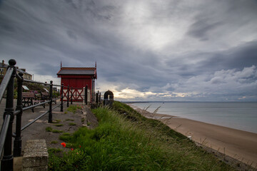 Victorian cliff lift with cloudy sky