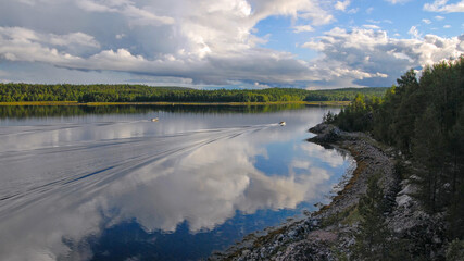 Karelian lseascape. Motor boats in Kandalaksha Gulf of White Sea. Keret archipelago, Republic of Karelia, Russia.