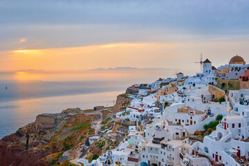 Famous greek iconic selfie spot tourist destination Oia village with traditional white houses and...