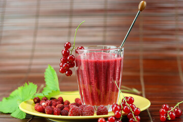 close up of red shake of  berries in a glass