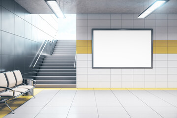 Chairs for waiting in modern metro station with blank poster.
