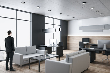 Businessman standing in modern office