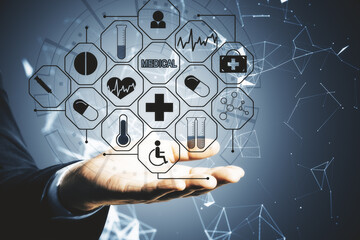 Hand holding glowing medical interface.